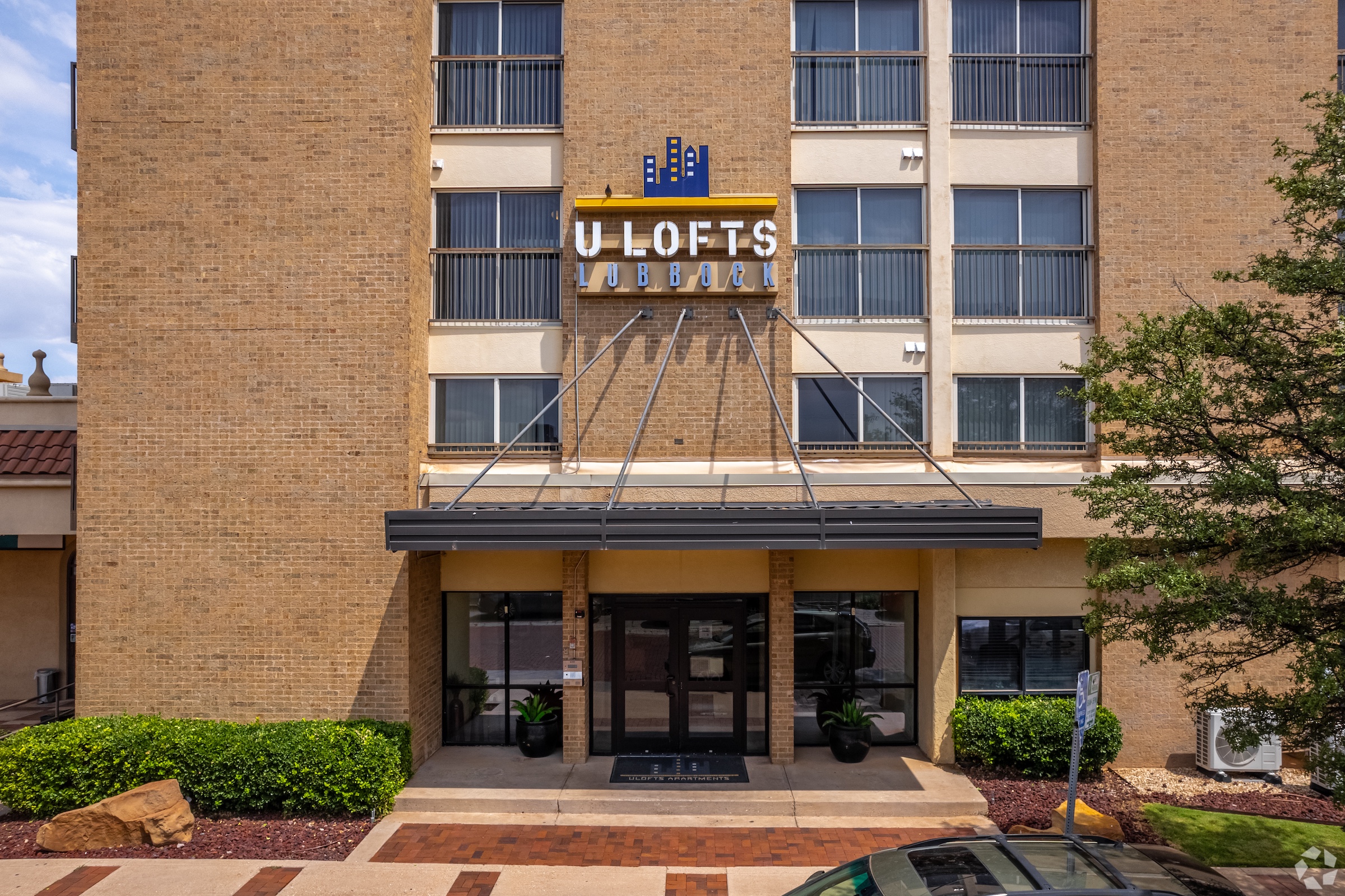 Modern hotel entrance with signage