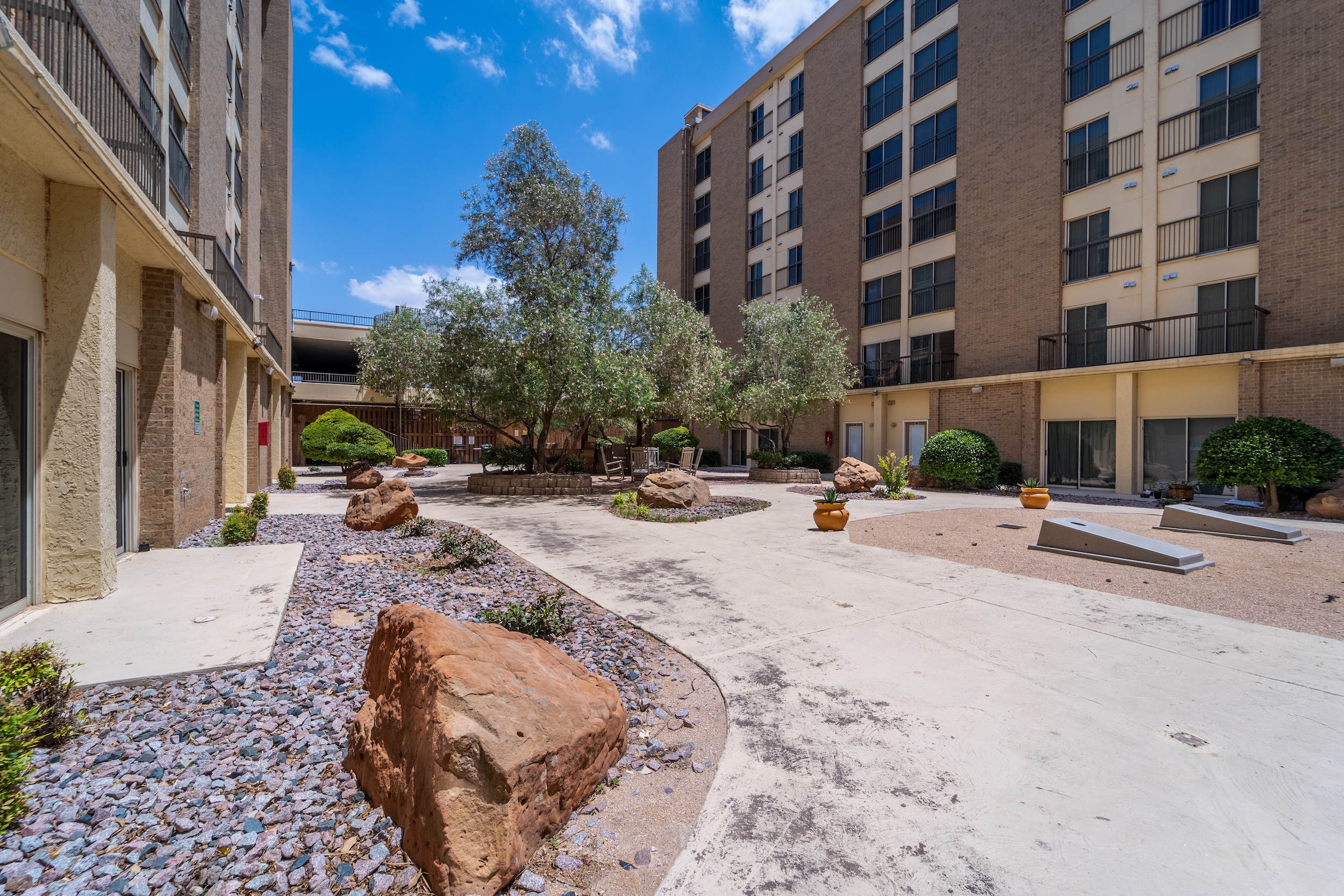Urban courtyard with rocks and greenery