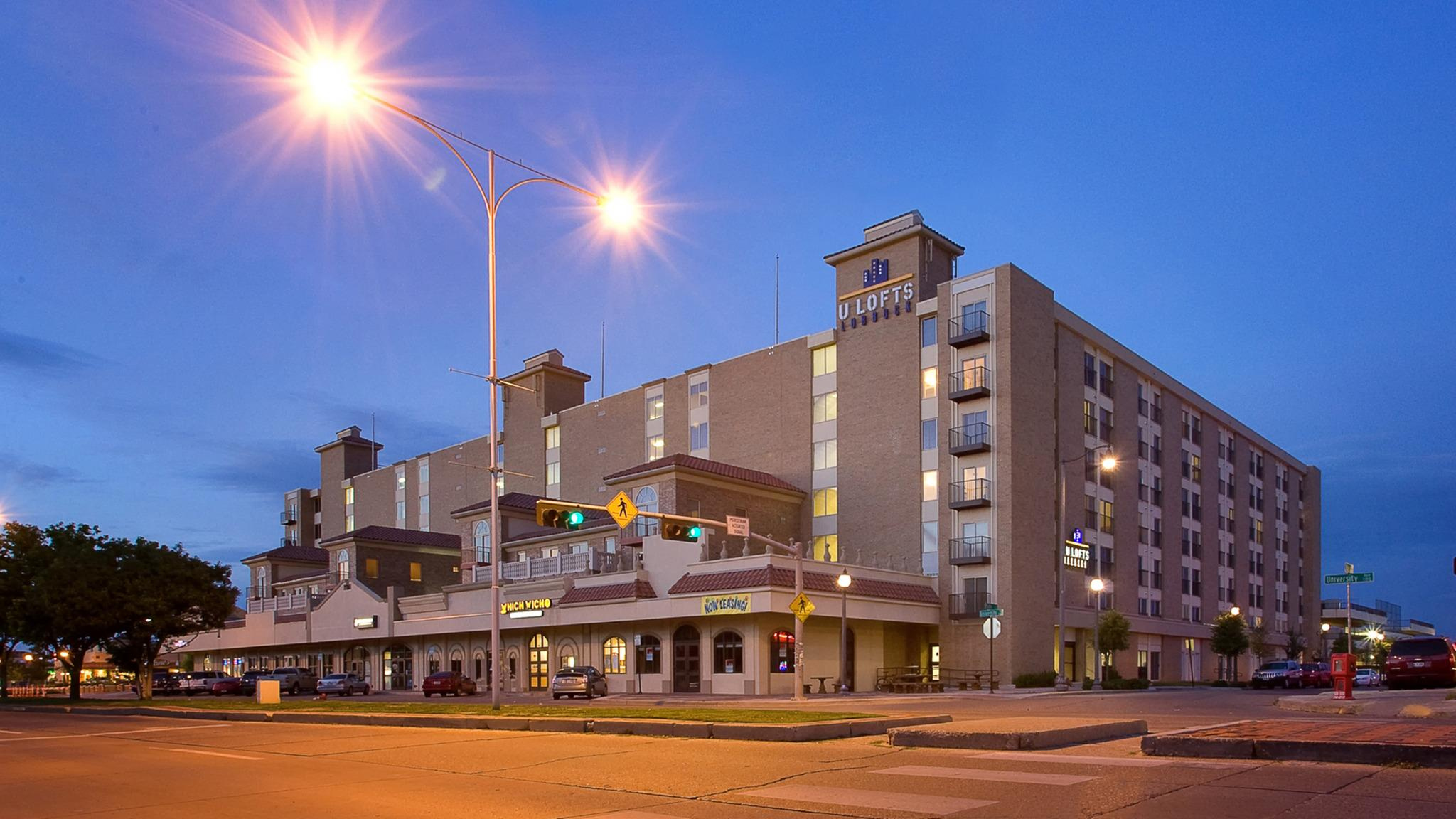 Hotel building at dusk with lights